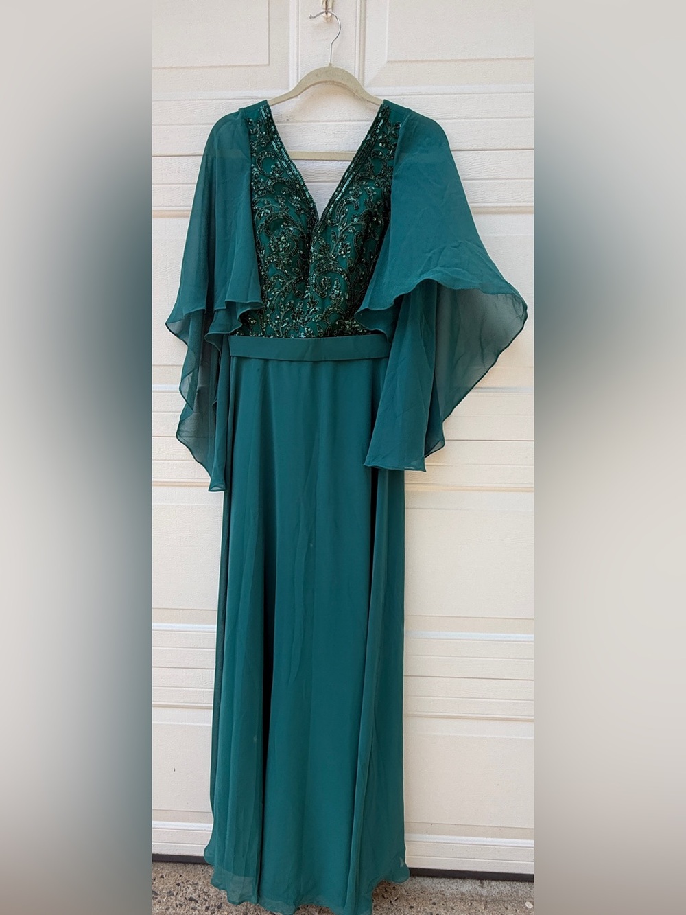Emerald green formal gown beaded deep V-neckline and sheer cape sleeves size 12